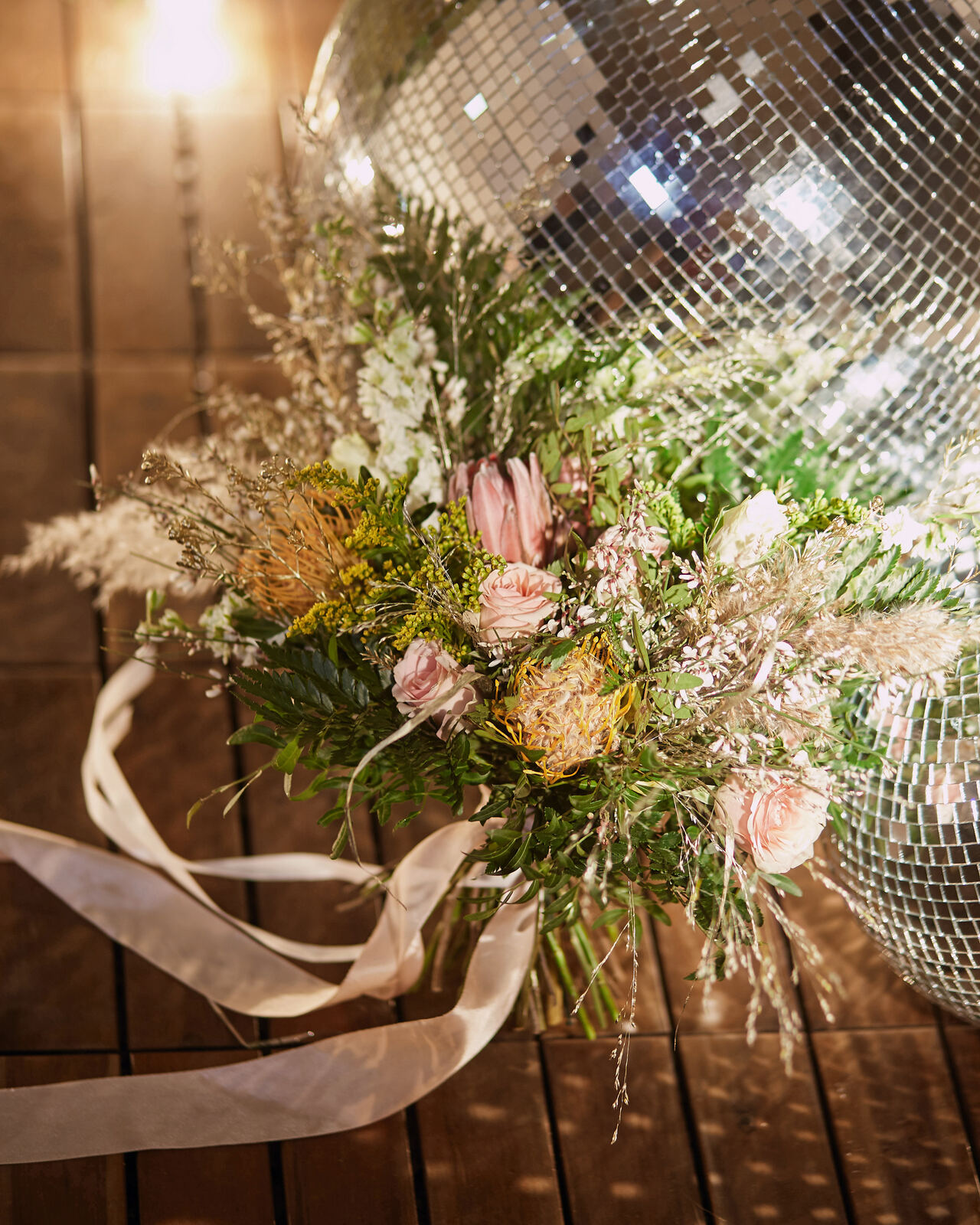 Bouquet beside a disco ball